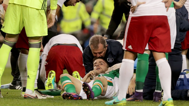 Brady receives treatment on the Aviva Stadium pitch after his clash of heads