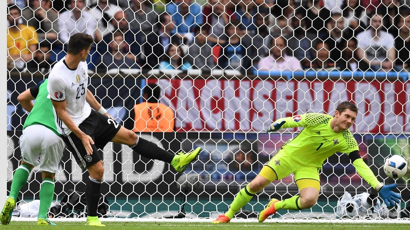 Michael McGovern (R) saves from Mario Gomez (L) during the summer Euros