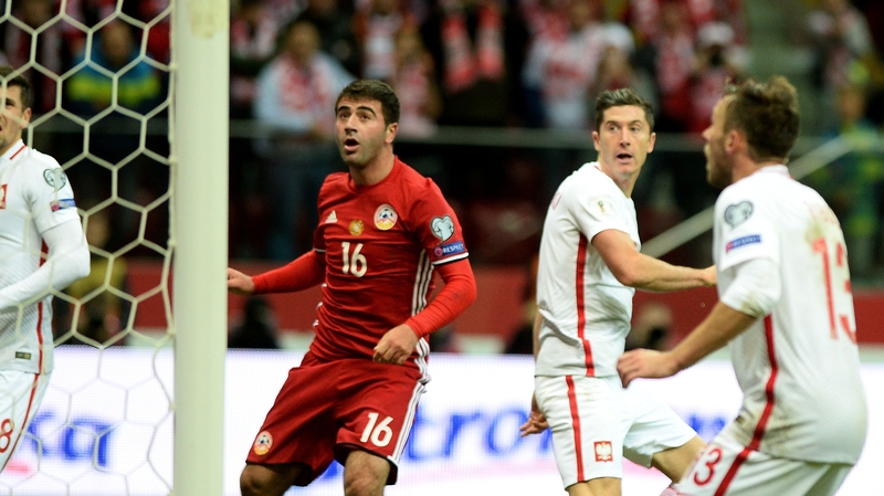 Poland's forward Robert Lewandowski scores the winner