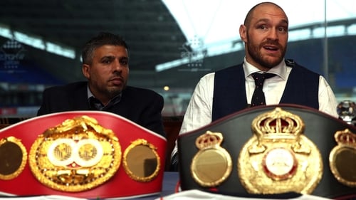 Tyson Fury (R) said: 'I have taken the hard and emotional decision to now officially vacate my treasured world titles.'