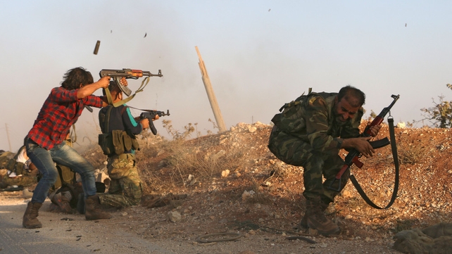 Fighters from the Free Syrian Army take part in a battle against the so-called Islamic State in the northern Syrian village of Yahmoul north of Aleppo