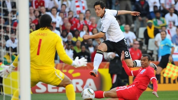 Mesut Ozil skips past Ashley Cole during Germany's clash with England at the 2010 World Cup