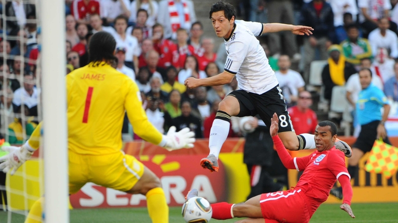 Mesut Ozil skips past Ashley Cole during Germany's clash with England at the 2010 World Cup