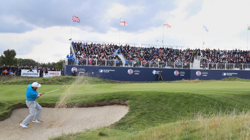 Graeme McDowell plays from a bunker on the 18th