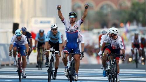 Peter Sagan of Slovakia celebrates victory as Britain's Mark Cavendish looks across to check that he had edged out Tom Boonen of Belgium for silver