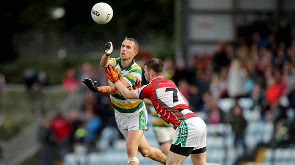 Ballincollig's Cian Kiely and Kevin McMahon of Carbery Rangers