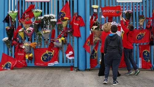 Munster Rugby fans place tributes outside Thomond Park in Limerick