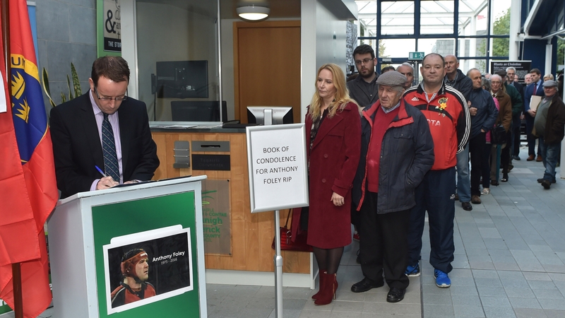 People queue in Limerick City Hall to sign book of condolence