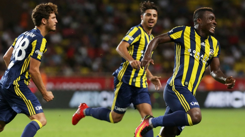 Fenerbahce's Emmanuel Emmanuel Emenike (R) celebrates with teammates after scoring during the Champions League third qualifying round against Monaco