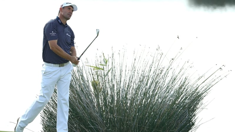 Harrington hits an approach after taking a drop on the 18th hole during day one of the Portugal Masters
