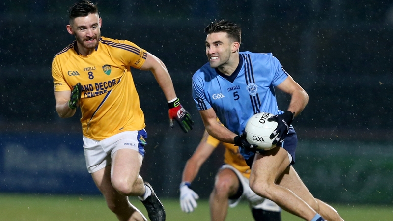 Killyclogher's Tiernan McCann is chased by Padraig Hampson of Coalisland