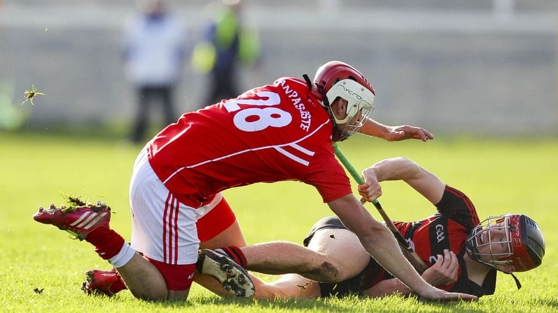 Ballygunner's Eddie Hayden battles with Passage's John Whitty at Walsh Park