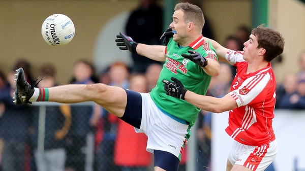 Senan Kilbride of St Brigid's tussles with David Murray of Padraig Pearses