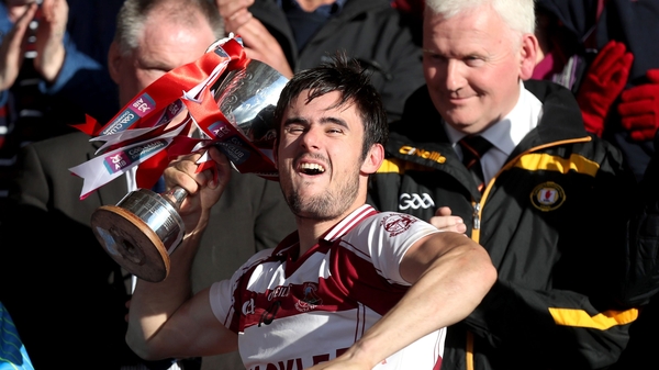 Chrissy McKaigue hoists the cup after Slaughtneil won the Ulster club SHC in October