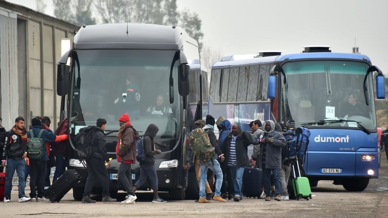 Buses take people from the camp to registration centres