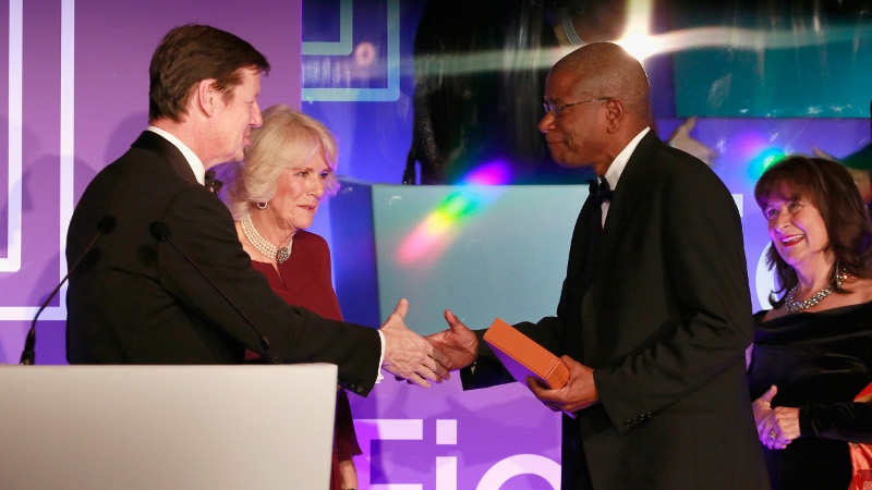 Luke Ellis and Camilla, Duchess of Cornwall present Paul Beatty with his Booker prize in London on Tuesday night