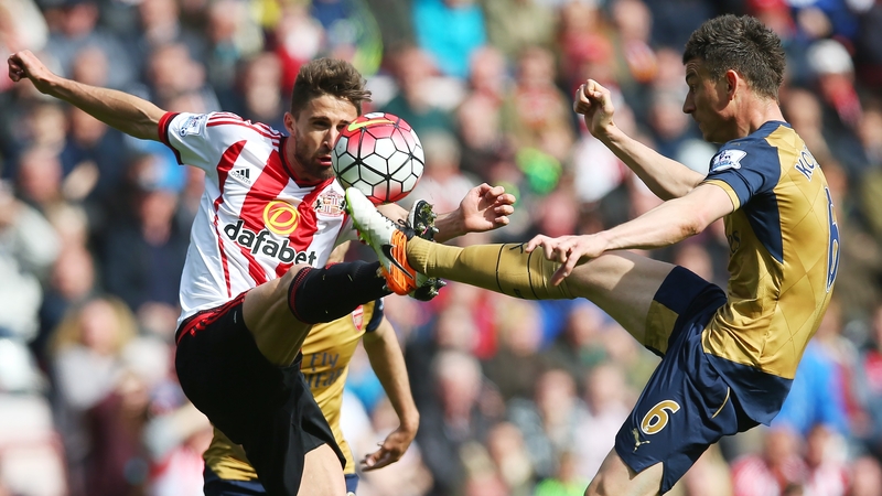 Sunderland's Fabio Borini goes toe-to-toe with Laurent Koscielny last April