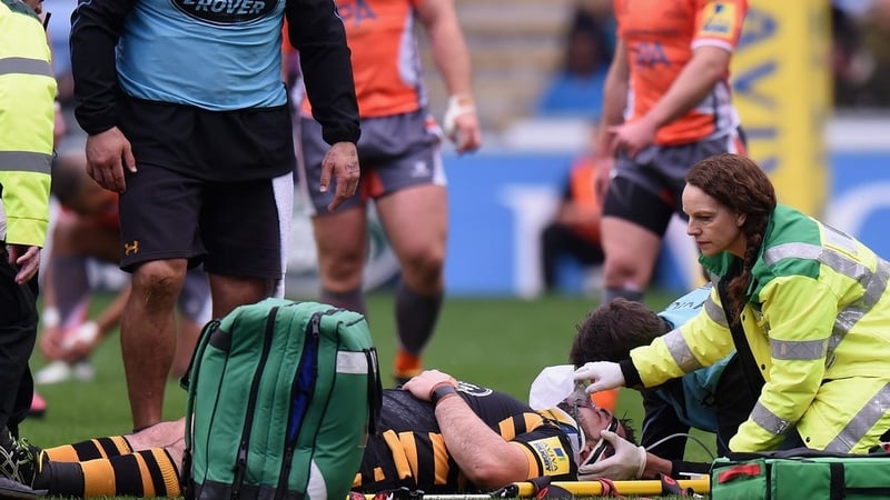 Marty Moore receives treatment on the Ricoh Arena pitch
