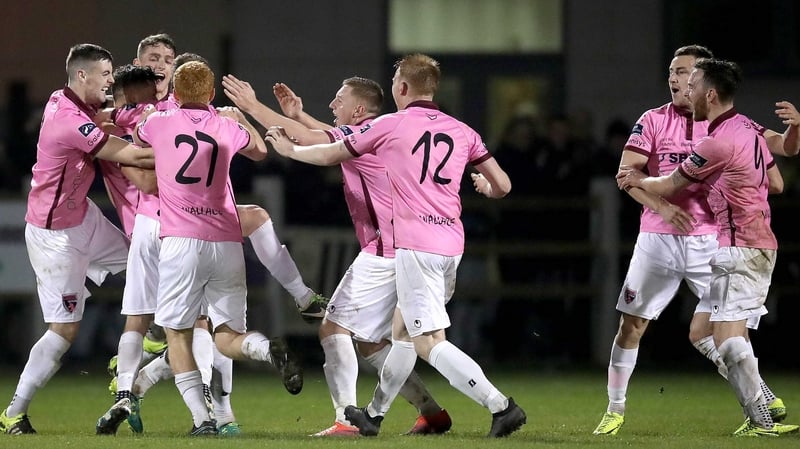 Wexford Youths players mob Lee Chin after his terrific late goal