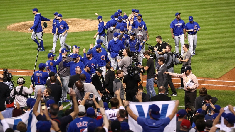 The Chicago Cubs celebrate after defeating the Cleveland Indians