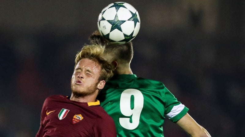 Cork's Aaron Drinan rises with Lorenzo Grossi of Roma