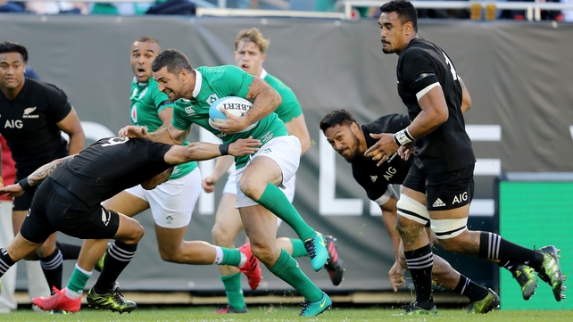 Rob Kearney attempts to make a break with Aaron Smith in attendance