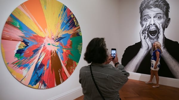 Damien Hirst work (pictured ledt) at the Bowie/Collector exhibtion and sale. Photo credit: Daniel Leal-Olivas/AFP/Getty Images