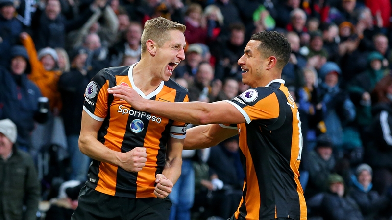 Michael Dawson (L) celebrates scoring Hull's winner with Curtis Davies