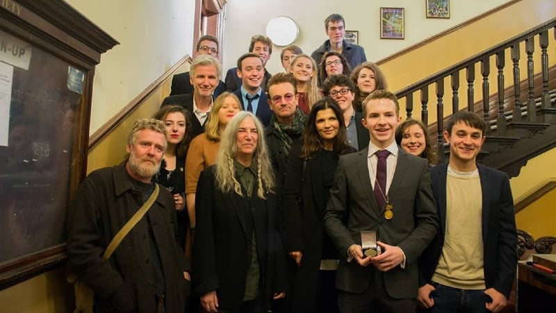 Patti Smith, pictured at Trinity College with members of the College Historical Society (The Hist), plus Bono and Glen Hansard (Photo courtesy of The Hist Facebook page)