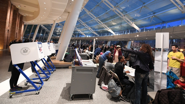 People vote at the Brooklyn Museum polling station in the Brooklyn borough of New York City