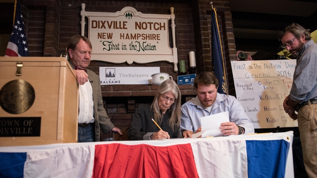 Clerks tabulate ballots at a polling station just after midnight in Dixville Notch, New Hampshire, the first voting to take place in the 2016 US presidential election