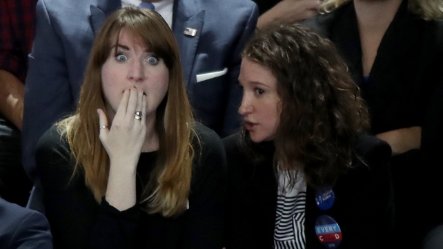 A woman reacts as she watched voting results