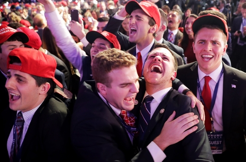 People cheer as voting results for Iowa were announced
