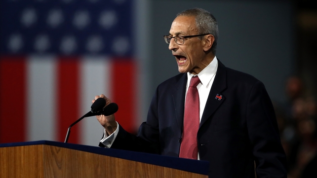 Campaign chairman John Podesta told the crowd that the election was still too close to call
