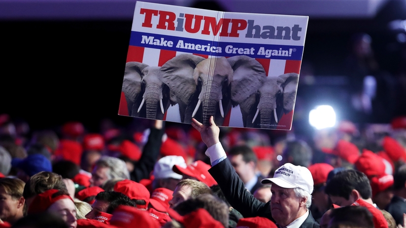 A supporter holds up a sign in support of Republican presidential nominee Donald Trump