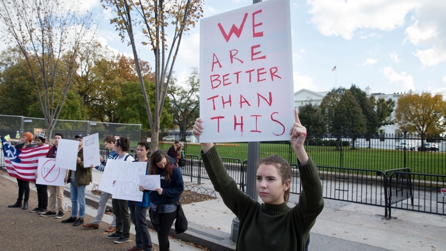 A small number of people gathered outside the White House shortly after Trump's election was confirmed