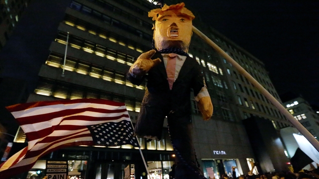 Protesters hold up an effigy of Trump during a protest in New York