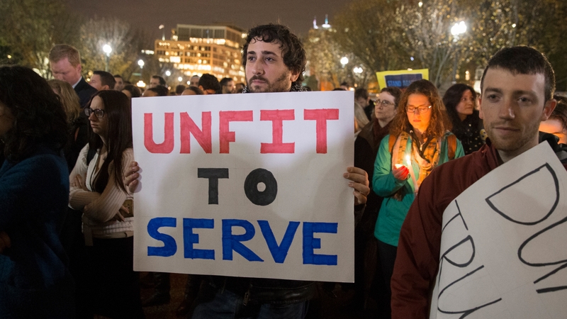 People attend a candlelight vigil after outside the White House after Hillary Clinton's loss to Donald Trump