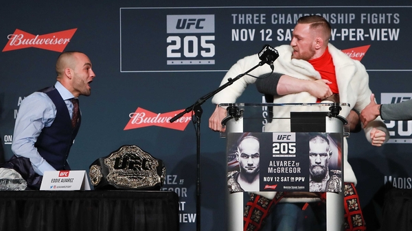 McGregor in his 'Gucci mink' coat goads Alvarez earlier today