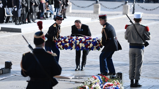 French President Francois Hollande lays a wreath in front of the statue of Georges Clemenceau in Paris
