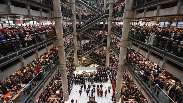 Workers and guests mark the two minute silence for Armistice Day in the Lloyd’s Building in London, England