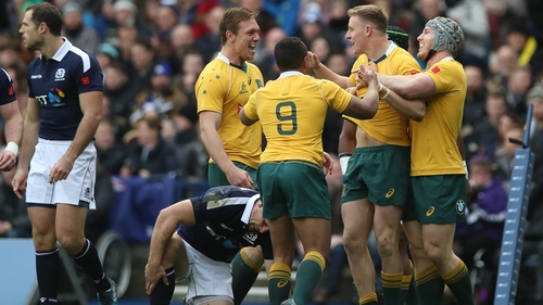 Reece Hodge celebrates his try against Scotland