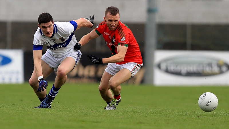 Diarmuid Connolly vies for possession with Palatine's Christopher Crowley