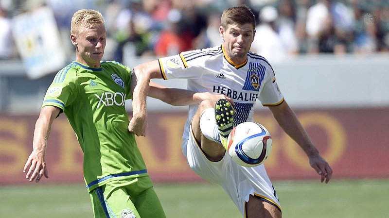 Steven Gerrard (R) has been linked with a return to Liverpool