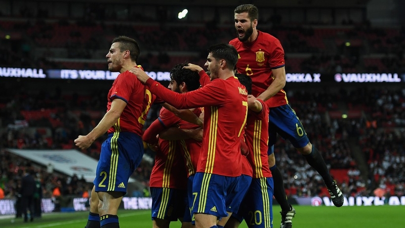 Spain players celebrate their injury time equaliser