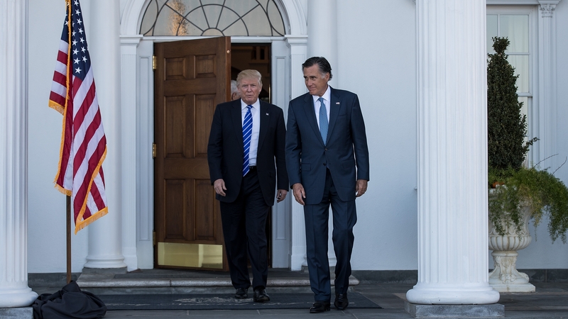 Donald Trump and Mitt Romney leave the clubhouse after their meeting at Trump International Golf Club