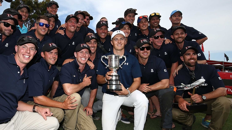 Jordan Spieth poses with green-keeping staff after his win