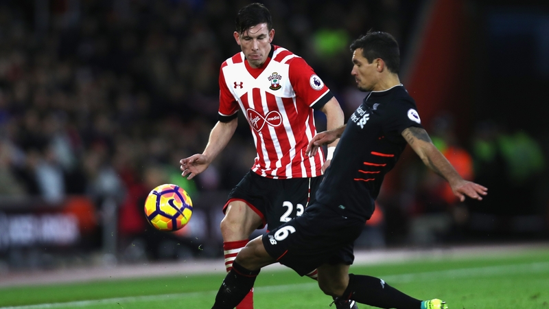 Hojbjerg takes on Liverpool's Dejan Lovren