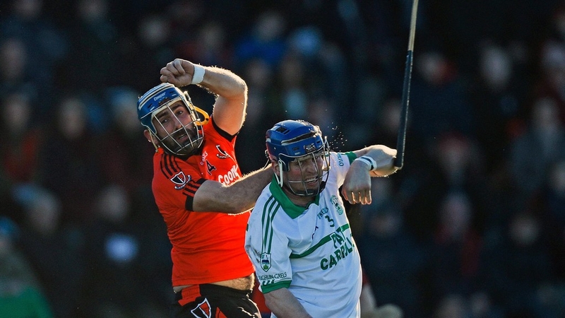 Oulart's Garrett Sinnott with Andy Kearns of O'Loughlin Gaels
