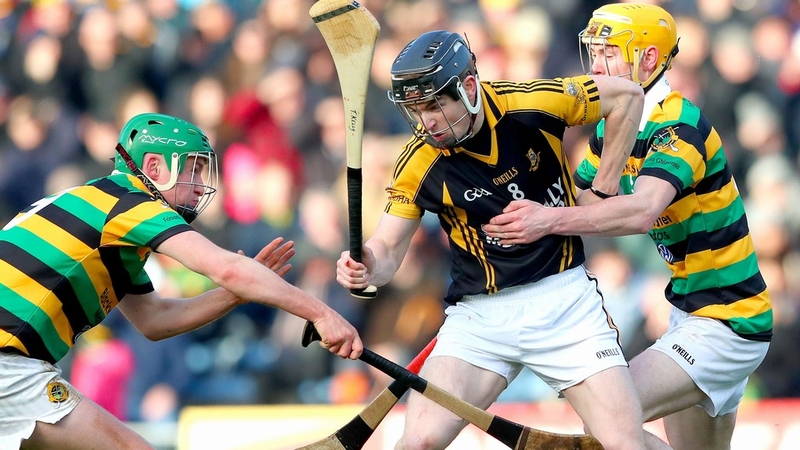 Glen Rovers' David Dooling and David Noonan tackle Tony Kelly of Ballyea